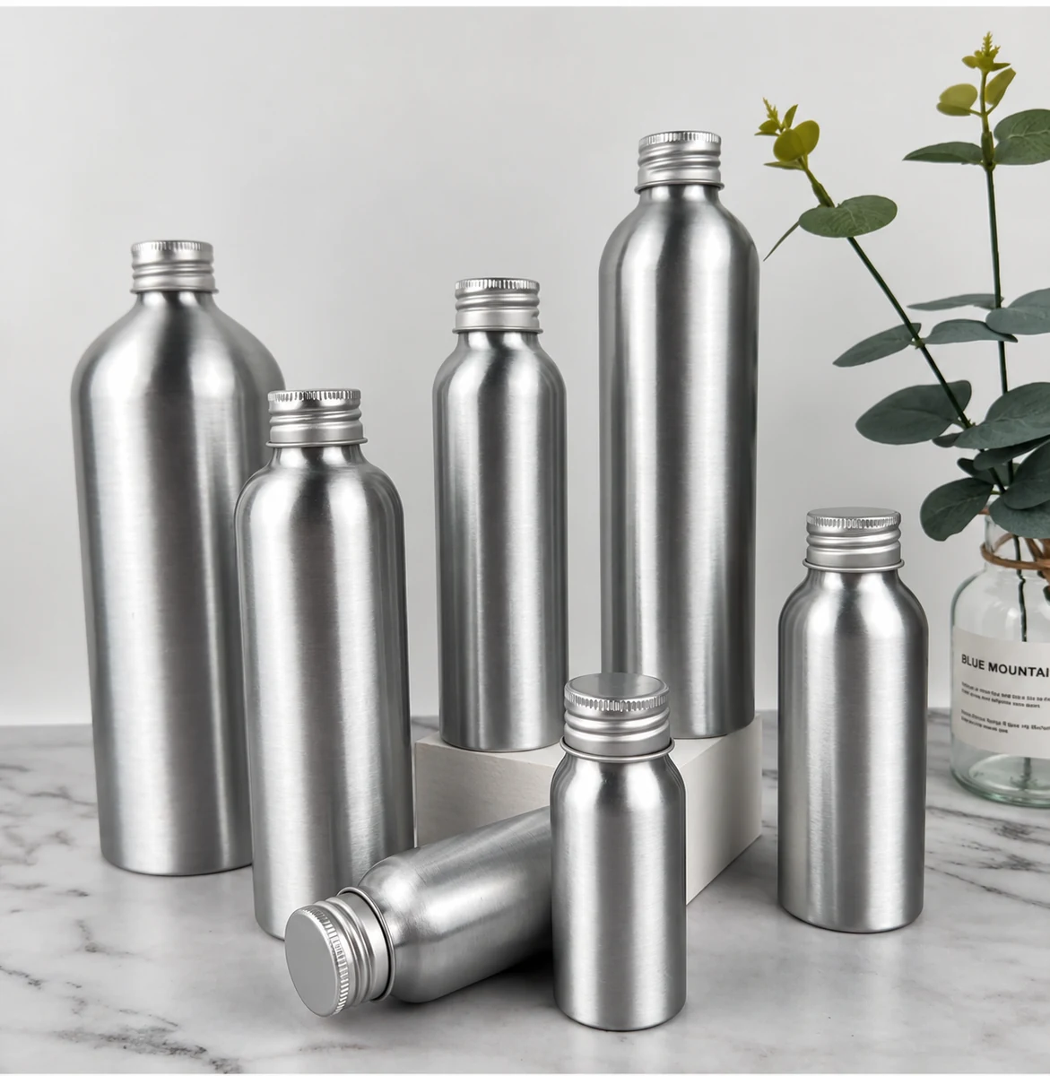 Aluminum bottles with natural metallic reflections